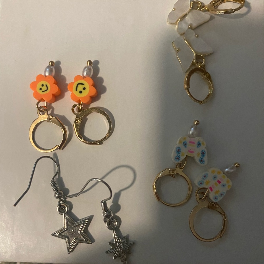 Novelty earrings. Four pairs unworn.